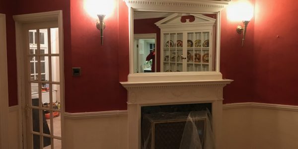 fireplace with mirror above