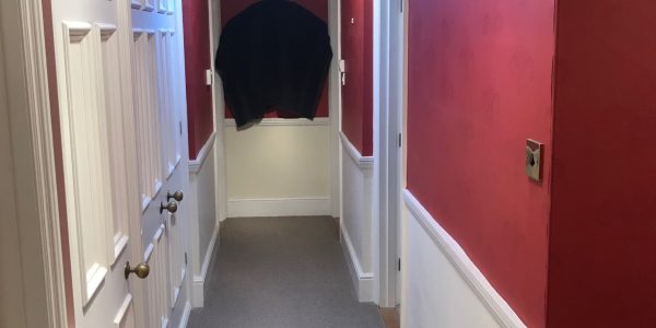 hallway with red walls