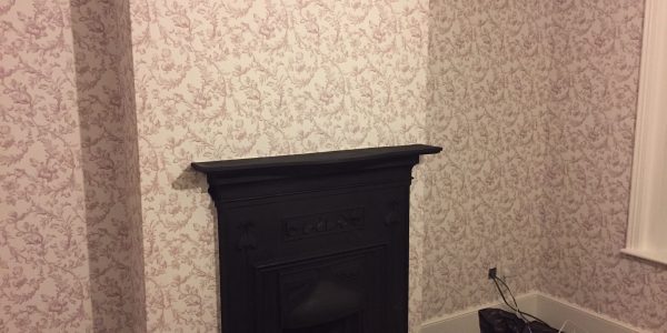 wallpaper around the fire place
