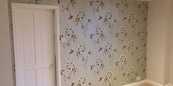 wallpaper around door on side wall