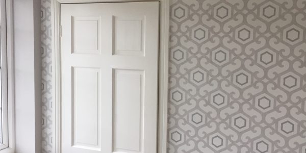 wallpaper around door frame
