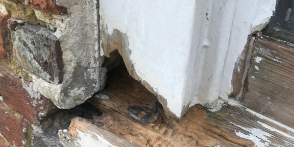 chipped corner of wooden frame