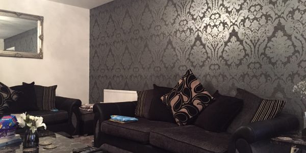 wallpaper on back living room wall