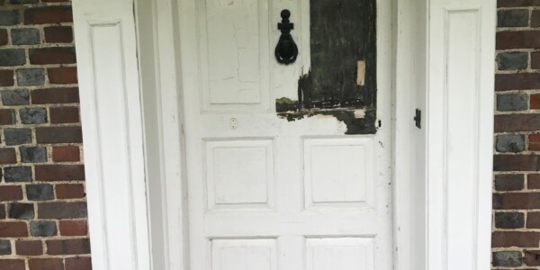 front door with paint stripped