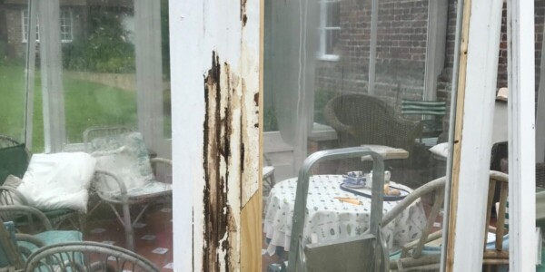 chipped wood on conservatory window